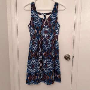 Teal blue aztec/animal print sleeveless dress with cutouts